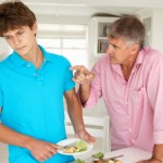 Father making teenage son do housework