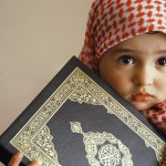 Cute-little-muslim-baby-holing-Holy-Quran